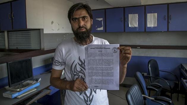 Feroz Ahmed, manager of "Kashmir Reader" newspaper shows a state government order in Srinagar on Oct. 4, 2016. The three-month ban on Kashmir Reader by the Jammu and Kashmir government was decided to be lifted on Monday.(AP file photo) Feroz Ahmed, manager of "Kashmir Reader" newspaper shows a state government order in Srinagar on Oct. 4, 2016. The three-month ban on Kashmir Reader by the Jammu and Kashmir government was decided to be lifted on Monday.(AP file photo)