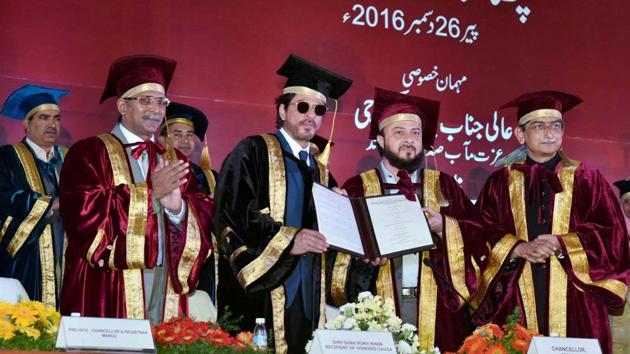 Chancellor Zafar Younus Sareshwala confers an honorary doctorate degree upon Shah Rukh Khan at Maulana Azad National Urdu University in Hyderabad. (PTI)