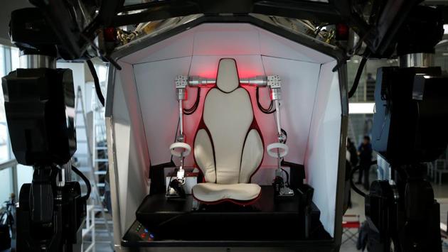 The robot, more than twice the size of a tall man, is so heavy that it shakes the ground when it takes a step with a loud whirring of motors. (REUTERS)