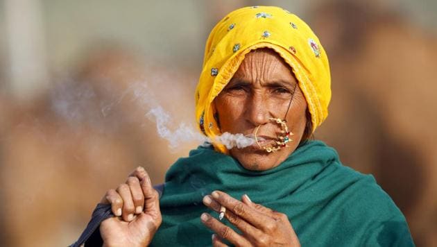 A woman makes HT photojournalist Deepak Sharma’s frame at the annual cattle fair in Pushkar, Rajasthan, in November. Pushkar becomes a photographer’s delight when it hosts the world’s largest camel fair.(Deepak Sharma/ HT Photo)