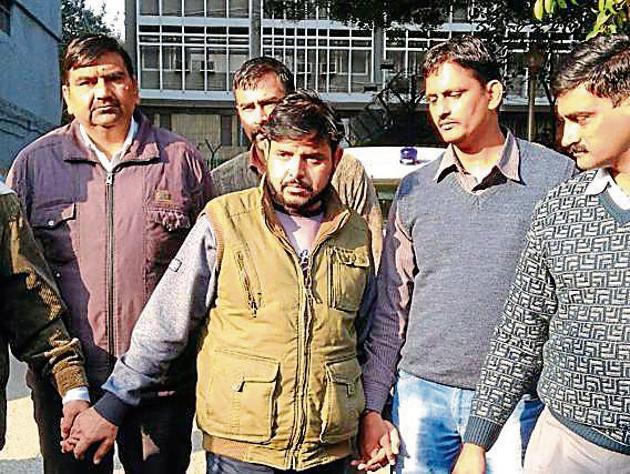 The 39-year-old kingpin, Sweekar Luthra, in police custody. The 39-year-old kingpin, Sweekar Luthra, in police custody.