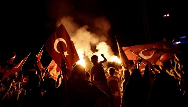 Pro-Erdogan supporters wave Turkish national flags during a rally at Taksim square in Istanbul on July 18, 2016 following the military failed coup attempt of July 15. (AFP Photo) Pro-Erdogan supporters wave Turkish national flags during a rally at Taksim square in Istanbul on July 18, 2016 following the military failed coup attempt of July 15. (AFP Photo)
