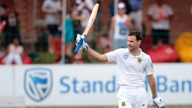 South African batsman Stephen Cook (R) raises his bat as he celebrates after scoring a century against Sri Lanka.(AFP)