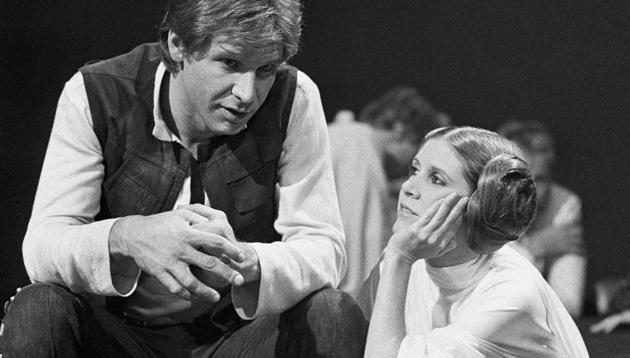 Harrison Ford talks with Carrie Fisher during a break in the filming of the CBS-TV special ‘The Star Wars Holiday’ in Los Angeles.(AP File Photo) Harrison Ford talks with Carrie Fisher during a break in the filming of the CBS-TV special ‘The Star Wars Holiday’ in Los Angeles.(AP File Photo)