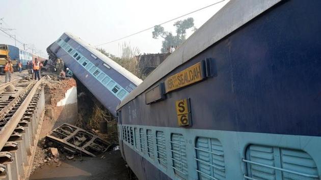Rescuers and railway officials stand next to derailed coaches of a passenger train near Kanpur.(Reuters) Rescuers and railway officials stand next to derailed coaches of a passenger train near Kanpur.(Reuters)
