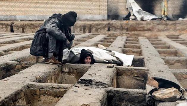 One of the many homeless dwellers in a cemetery in the town of Shahriar, near Iran’s capital Tehran.(Twitter)