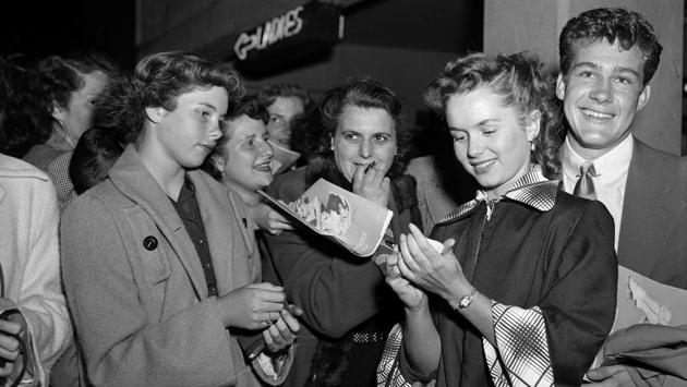 In this May 7, 1951, file photo, actress Debbie Reynolds signs autographs on her way into the ice show in the Hollywood section of Los Angeles. (AP File Photo) In this May 7, 1951, file photo, actress Debbie Reynolds signs autographs on her way into the ice show in the Hollywood section of Los Angeles. (AP File Photo)