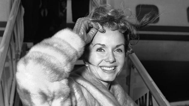 In this March 6, 1959, file photo actress Debbie Reynolds boards an airliner in New York en route to Spain where she will film a new picture. (John Rooney/AP File Photo) In this March 6, 1959, file photo actress Debbie Reynolds boards an airliner in New York en route to Spain where she will film a new picture. (John Rooney/AP File Photo)
