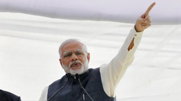 PM Narendra Modi addresses a rally at Parade Ground in Dehradun, on December 27.(HT Photo) PM Narendra Modi addresses a rally at Parade Ground in Dehradun, on December 27.(HT Photo)