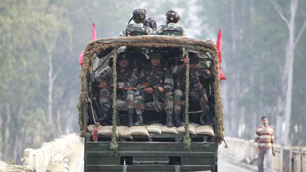 Soldiers patrol a highway outside an army base in Nagrota.(AP Photo) Soldiers patrol a highway outside an army base in Nagrota.(AP Photo)