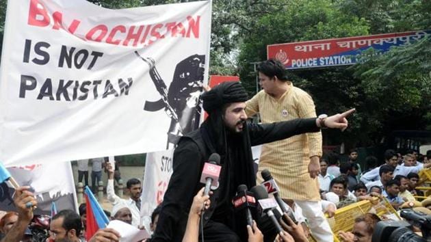 In this file photo from September 2016, Mazdak Dilshad Baloch, son of prominent author-activist Naela Qadri Baloch and filmmaker Mir Ghulam Mustafa Raisaini who lives in Canada in exile, climbs during a protest against Pakistan near Pakistani Embassy against human rights violation in Balochistan.(HT Photo) In this file photo from September 2016, Mazdak Dilshad Baloch, son of prominent author-activist Naela Qadri Baloch and filmmaker Mir Ghulam Mustafa Raisaini who lives in Canada in exile, climbs during a protest against Pakistan near Pakistani Embassy against human rights violation in Balochistan.(HT Photo)