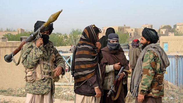 File photo of members of the Taliban at the site of the execution of three men accused of murdering a couple in Ghazni province, Afghanistan in April 2015.(Reuters)