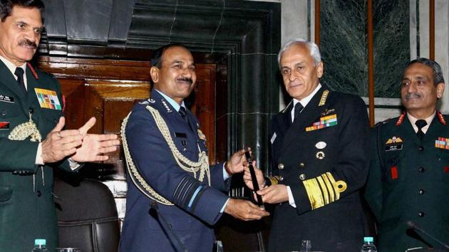 Chief of Naval Staff, Admiral Sunil Lanba received the Chairman's Chief of Staff Committee (COSC) baton from outgoing Chief of Air Staff, Air Chief Marshal Arup Raha at a ceremony in New Delhi on Thursday.(PTI) Chief of Naval Staff, Admiral Sunil Lanba received the Chairman's Chief of Staff Committee (COSC) baton from outgoing Chief of Air Staff, Air Chief Marshal Arup Raha at a ceremony in New Delhi on Thursday.(PTI)