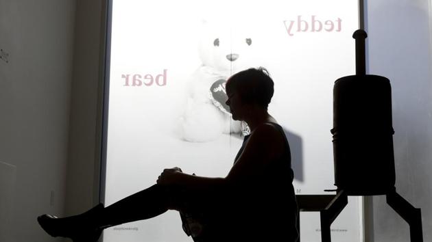 Amber Clisura poses for a picture next to the meat smoker she donated to the new Museum of Broken Relationships in Los Angeles. (AP) Amber Clisura poses for a picture next to the meat smoker she donated to the new Museum of Broken Relationships in Los Angeles. (AP)