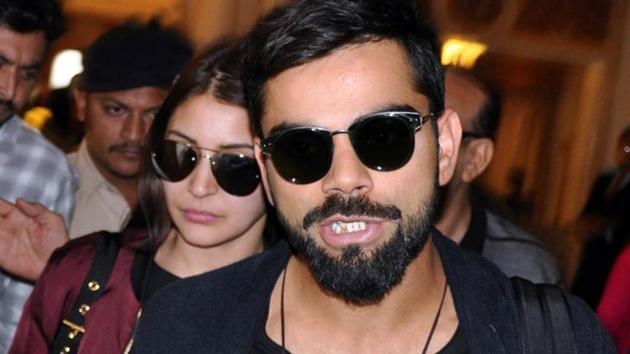 Indian test captain Virat Kohli with actor Anushka Sharma arrive at a hotel in Rajkot in November.(IANS) Indian test captain Virat Kohli with actor Anushka Sharma arrive at a hotel in Rajkot in November.(IANS)