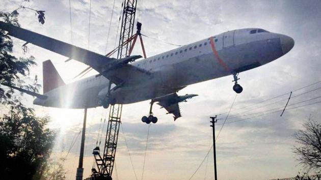 The empty Air India aircraft was being transported to the Begumpet airport for training purposes in Telangana's Hyderabad on December 25, 2016. The aircraft tipped, crashing to the ground near the airport. (PTI)