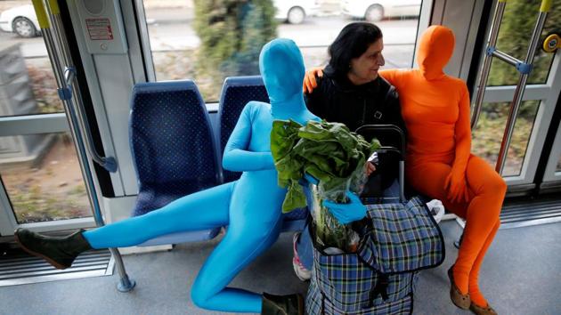 Members of the Prizma Ensemble, wearing full solid-coloured bodysuits, take part in the Jewish festival of Hanukkah in Jerusalem on December 26, 2016. (Amir Cohen / REUTERS)