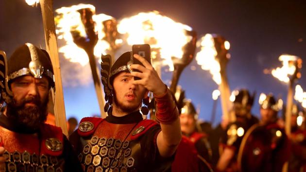 “Entering 2017, but first lemme take a selfie”: A member of Shetland’s Up Helly Aa’ Vikings clicks a selfie, dressed to lead the opening event of Edinburgh’s Hogmanay (New Year) celebrations with the traditional Torchlight Procession in Edinburgh, Scotland, on Friday. (AP) “Entering 2017, but first lemme take a selfie”: A member of Shetland’s Up Helly Aa’ Vikings clicks a selfie, dressed to lead the opening event of Edinburgh’s Hogmanay (New Year) celebrations with the traditional Torchlight Procession in Edinburgh, Scotland, on Friday. (AP)