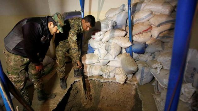 Iraq’s soldiers inspect a tunnel used by Islamic State militants during a battle near of Mosul on December 30, 2016. The country launched an offensive more nine weeks ago to retake the city that has been key to IS operations. (Khalid al Mousily / REUTERS)