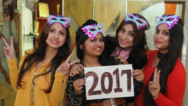 Students in Jalandhar welcoming the New Year on Saturday. (Pardeep Pandit/HT )