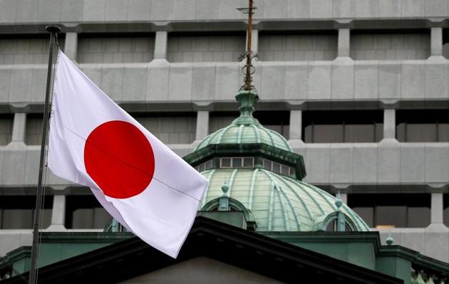 A Japanese flag flutters atop the Bank of Japan building in Tokyo(Reuters file photo) A Japanese flag flutters atop the Bank of Japan building in Tokyo(Reuters file photo)