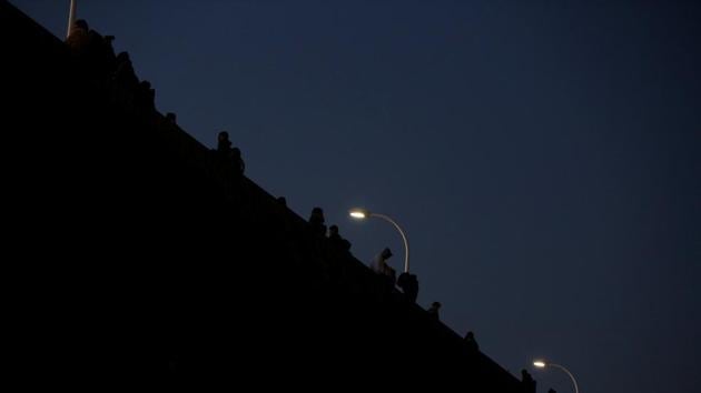 People wait for the opening of the gate at a music concert where a new year countdown will be held in Tokyo on Saturday. (Reuters) People wait for the opening of the gate at a music concert where a new year countdown will be held in Tokyo on Saturday. (Reuters)