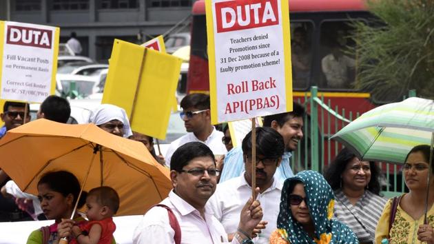 The ad-hoc teachers of Delhi University have demanded “absorption”, as they say, the appointment and promotion rules adopted by the universities statutory body is against them. (Sonu Mehta/HT Photo) The ad-hoc teachers of Delhi University have demanded “absorption”, as they say, the appointment and promotion rules adopted by the universities statutory body is against them. (Sonu Mehta/HT Photo)