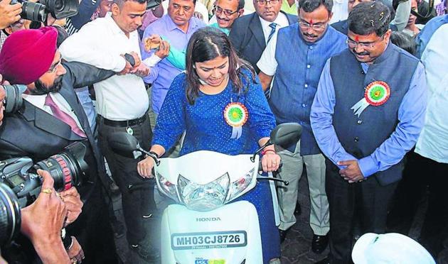 BJP’s youth wing president Poonam Mahajan rides a CNG bike.