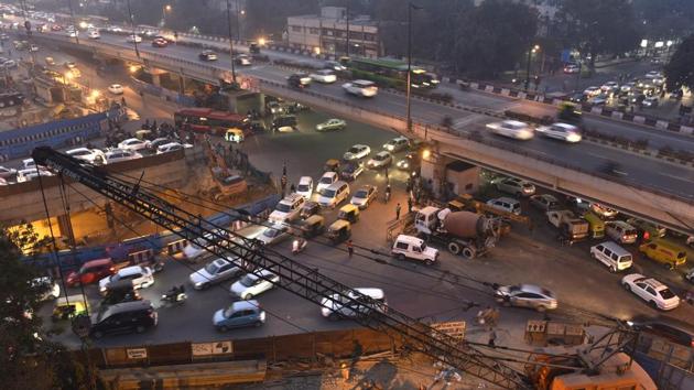 Roads dug up for Metro construction, constant road repair, lack of ample traffic officials to man traffic, and illegal parking on the roadside are major reasons behind congestion at Ashram Chowk. (Saumya Khandewlwal/HT photo) Roads dug up for Metro construction, constant road repair, lack of ample traffic officials to man traffic, and illegal parking on the roadside are major reasons behind congestion at Ashram Chowk. (Saumya Khandewlwal/HT photo)