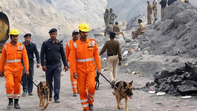 Rescue workers near the site of a search operation following the collapse of a coal mine in Godda, Jharkhand. (AFP photo) Rescue workers near the site of a search operation following the collapse of a coal mine in Godda, Jharkhand. (AFP photo)