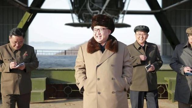 North Korea leader Kim Jong Un smiles as he visits Sohae Space Center in Cholsan County, North Pyongan province for the testing of a new engine for an intercontinental ballistic missile (ICBM) in this undated photo.(KCNA via Reuters File Photo)