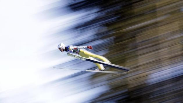 Daniel Andre Tande of Norway soars through the air during his qualification jump at the third stage of the 65th Four Hills Ski Jumping tournament in Innsbruck, Austria. (Matthias Schrader / AP)