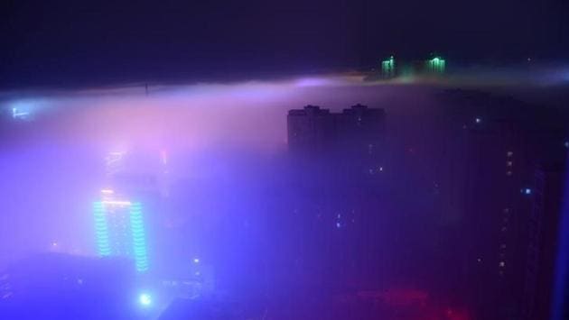 Buildings are seen in the fog in Yancheng, Jiangsu province, China. (Reuters)
