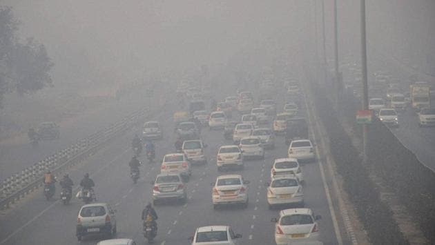 Vehicles move through dense fog in Gurugram. (PTI)