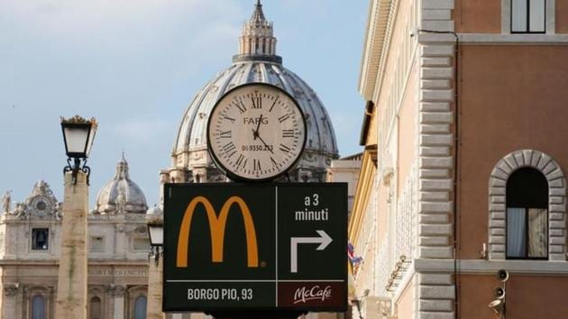 A McDonald's sign is seen at Via della Conciliazione street in Rome, Italy in front of Vatican City's St. Peter's Square January 3, 2017. REUTERS/Alessandro Bianchi A McDonald's sign is seen at Via della Conciliazione street in Rome, Italy in front of Vatican City's St. Peter's Square January 3, 2017. REUTERS/Alessandro Bianchi