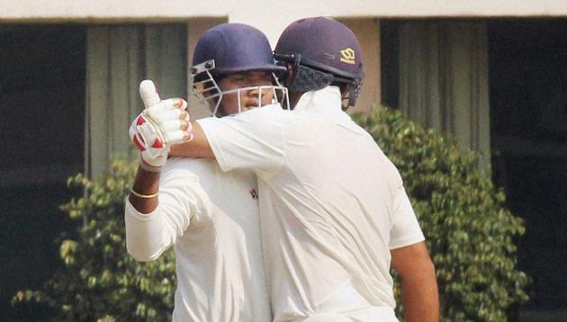 Jharkhand batsman Ishank Jaggi congratulates Kaushal Singh for completing his century against Gujarat during the Ranji Trophy semifinal match. (PTI) Jharkhand batsman Ishank Jaggi congratulates Kaushal Singh for completing his century against Gujarat during the Ranji Trophy semifinal match. (PTI)
