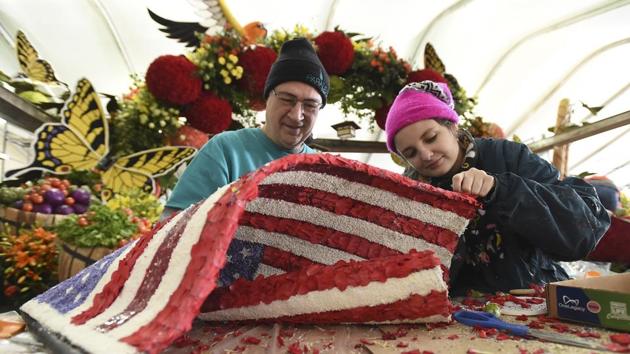 Volunteers finish up an American Flag covered entirely in organic material for the RAGU 80th anniversary float. (AP Photo) Volunteers finish up an American Flag covered entirely in organic material for the RAGU 80th anniversary float. (AP Photo)