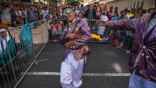 A man dances during the celebrations of the traditional Tweede Nuwe jaar (Second New Year) Parade. This yearly parade dates back to the mid-nineteenth century when the slaves in Cape Town were given one day off in the year. (Mujahid Safodien/AFP) A man dances during the celebrations of the traditional Tweede Nuwe jaar (Second New Year) Parade. This yearly parade dates back to the mid-nineteenth century when the slaves in Cape Town were given one day off in the year. (Mujahid Safodien/AFP)