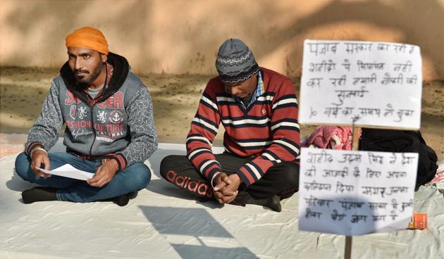 Shaheed Udham Singh’s kin sitting on a dharna demanding jobs from the Punjab government, at Jantar Mantar in New Delhi. (PTI) Shaheed Udham Singh’s kin sitting on a dharna demanding jobs from the Punjab government, at Jantar Mantar in New Delhi. (PTI)