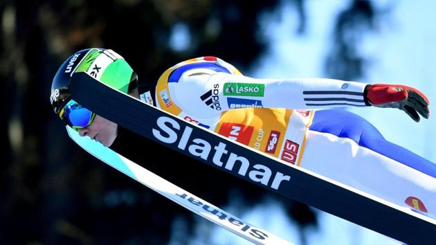 Domen Prevc of Slovenia soars through the air during his trial jump at the ski jumping event in Innsbruck. (APA / BARBARA GINDL / AFP)