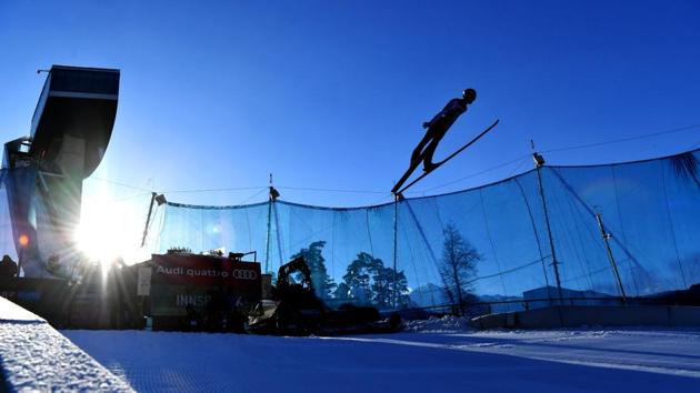 Daniel Huber of Austria soars through the air during his trial jump of the ski jumping event in Innsbruck. (APA / BARBARA GINDL / AFP)