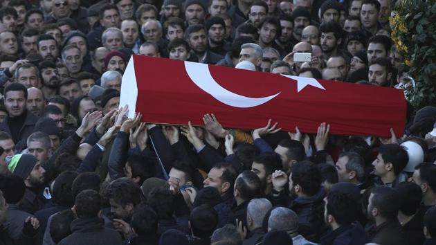Mourners carry the Turkish flag-draped coffin of Yunus Gormek, 23, one of the victims of the attack at a nightclub on New Year's Day, during the funeral in Istanbul. (AP Photo) Mourners carry the Turkish flag-draped coffin of Yunus Gormek, 23, one of the victims of the attack at a nightclub on New Year's Day, during the funeral in Istanbul. (AP Photo)