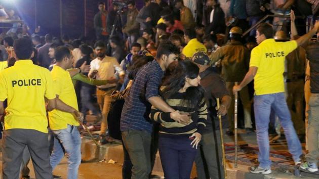 Police personnel try to manage the crowd during New Year’s Eve celebrations in Bengaluru on January 1, 2017. (AFP) Police personnel try to manage the crowd during New Year’s Eve celebrations in Bengaluru on January 1, 2017. (AFP)
