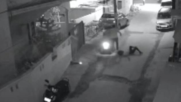 Two men on a scooter assault a woman, attempting to take off her clothes and pushing her to the ground before leaving, in Bengaluru. (CCTV capture)