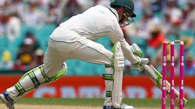 Australia's Peter Handscomb hits his wicket and is given out for 110 runs in the third cricket Test against Pakistan in Sydney.(REUTERS)