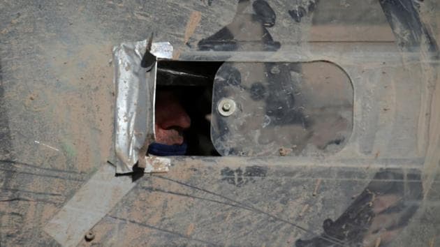 Co-pilot Jose Di Palma is pictured inside his Toyota after competing with his pilot Carlos Aguero of Argentina. (Ricardo Moraes/REUTERS)