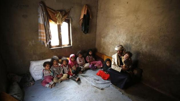 In this Monday, March 28, 2016 photo, Faisal Ahmed, whose infant son, Udai Faisal, died of severe acute malnutrition, sits with his nine remaining children at his house in Hazyaz village on the southern outskirts of Sanaa, Yemen. (AP File Photo) In this Monday, March 28, 2016 photo, Faisal Ahmed, whose infant son, Udai Faisal, died of severe acute malnutrition, sits with his nine remaining children at his house in Hazyaz village on the southern outskirts of Sanaa, Yemen. (AP File Photo)