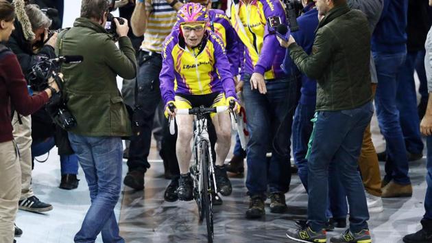 French cyclist Robert Marchand, aged 105, prepares to warm up prior to cycle in a bid to beat his record for distance cycled in one hour, at the velodrome of Saint-Quentin en Yvelines, outside Paris, Wednesday, Jan. 4, 2017. (Francois Mori / AP) French cyclist Robert Marchand, aged 105, prepares to warm up prior to cycle in a bid to beat his record for distance cycled in one hour, at the velodrome of Saint-Quentin en Yvelines, outside Paris, Wednesday, Jan. 4, 2017. (Francois Mori / AP)