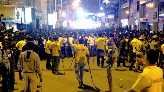 Police personnel try to manage the crowd during New Year's Eve celebrations in Bengaluru on January 1, 2017. (AFP file photo) Police personnel try to manage the crowd during New Year's Eve celebrations in Bengaluru on January 1, 2017. (AFP file photo)