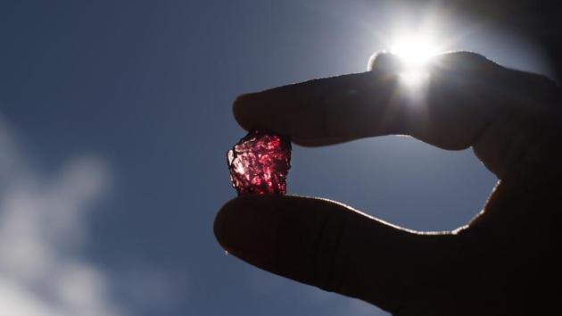 A buyer checking a ruby in the gems market in Mogok, north of Mandalay. Myanmar produces more than 80 percent of the world's rubies, yet decades of isolation under the former military junta means the industry remains cloaked in mystery. (Ye Aung Thu/AFP) A buyer checking a ruby in the gems market in Mogok, north of Mandalay. Myanmar produces more than 80 percent of the world's rubies, yet decades of isolation under the former military junta means the industry remains cloaked in mystery. (Ye Aung Thu/AFP)